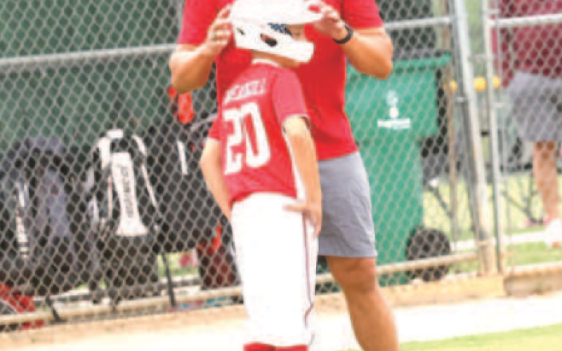 Photo by Chuck Grafe Coach Ryan Wagner talks to Brax Threadgill during a pitching change.