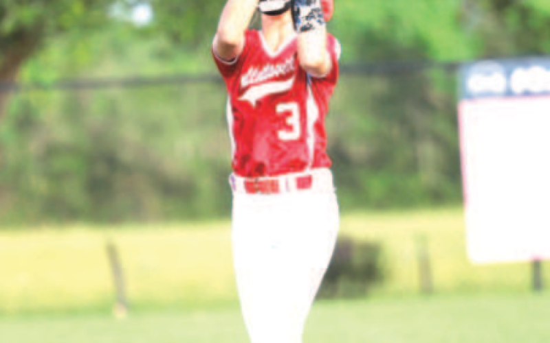 Photo by Chuck Grafe Amryn Etzler catches a pop fly in the second inning.