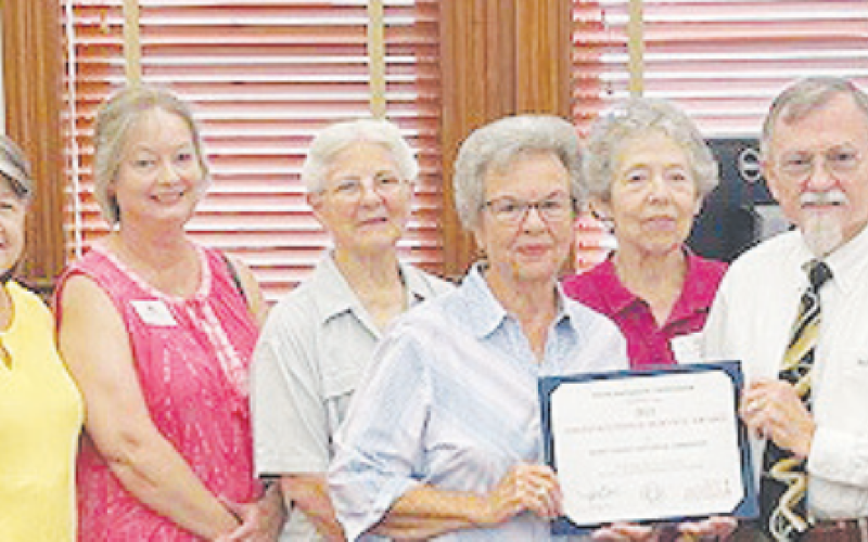 The DeWitt County Historical Commission received a Distinguished Service Award certificate at the DeWitt County Commissioners Court meeting July 14. Pictured from left to right are Historical Commission members Dan Williams, Mary Sue Williams, Shanna Burge, Marjie Kacir, Peggy Ledbetter, Betty Burda, DeWitt County Judge Daryl Fowler, and Historical Commission member Barbara Fogelle.