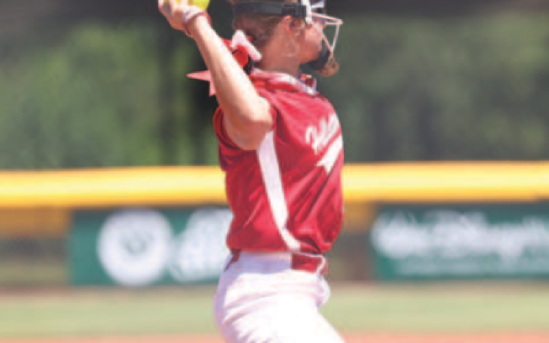 Photo by Chuck Grafe Landry Whitley makes a throw to first in the Thursday game..