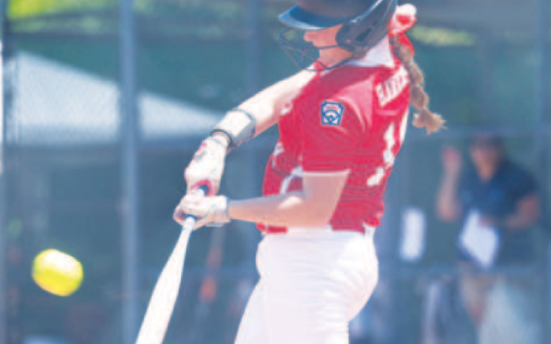 Photo by Chuck Grafe Piper Hawkins hits an RBI single in the first inning of Thursday’s loss.