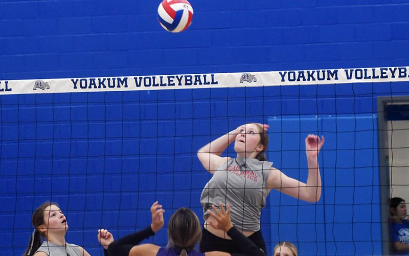 Addy Matias jumps for a kill attempt in St. Paul’s scrimmage with Shiner Friday in Yoakum. Photo by Mark Lube.