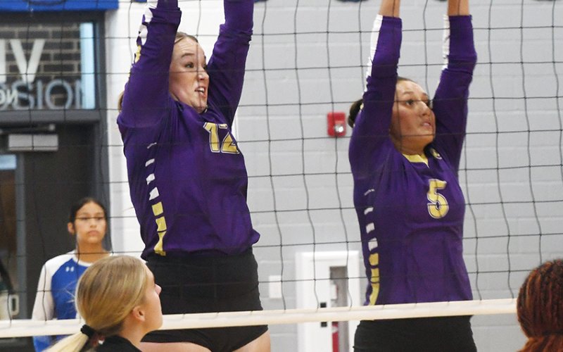 Harlee Sevcik (left) and Kylynn Ramirez attempt a combo block in the Aug. 12 against Gonzales in Yoakum. Photo by Mark Lube.
