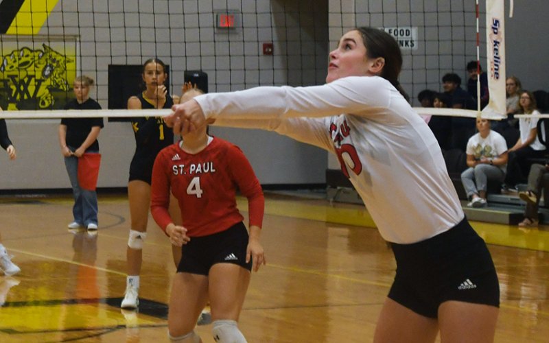 Tatum Walker gets one of her seven digs against Yorktown in the Yorktown Tournament on Friday.  Photo by Mark Lube.