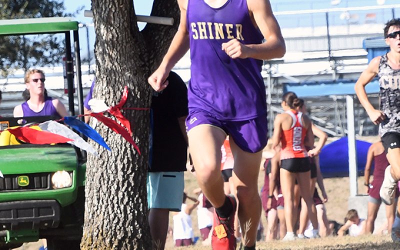 Logan Benavidez is at the top of the hill close to the finish line. He placed No. 20 in the varsity boys 1A-2A. Photo by Mark Lube.