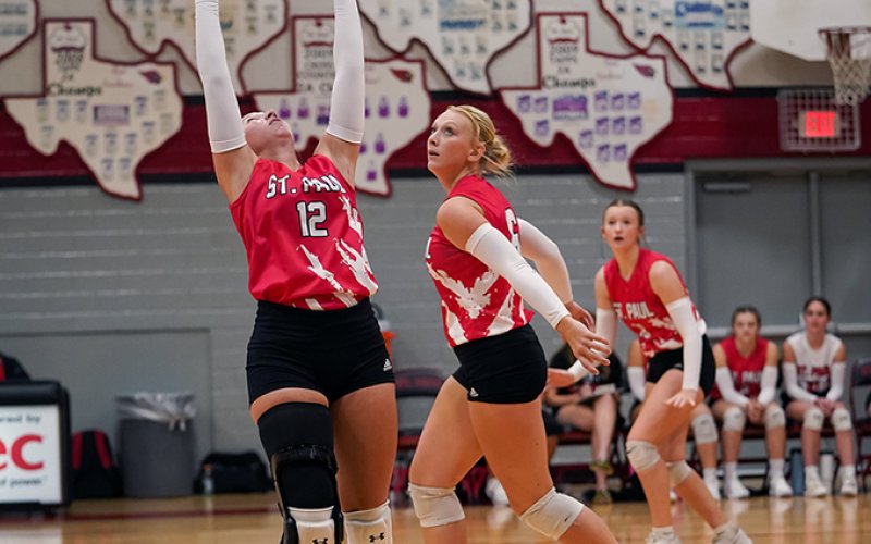 Sloane Kocian makes a set with Emery Kennedy and Reese Chilek also nearby. Kocian had 18 assists in St. Paul’s 3-2 defeat to Yoakum on Aug. 26. Photo courtesy of Photos by Lori Raabe.