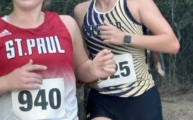 City of Shiner cross-country runners, from left Faith Brown (St. Paul) and Addy Siegel (Shiner ISD) run in the Gonzales meet on Saturday. Photo courtesy of Michelle Winkenwerder