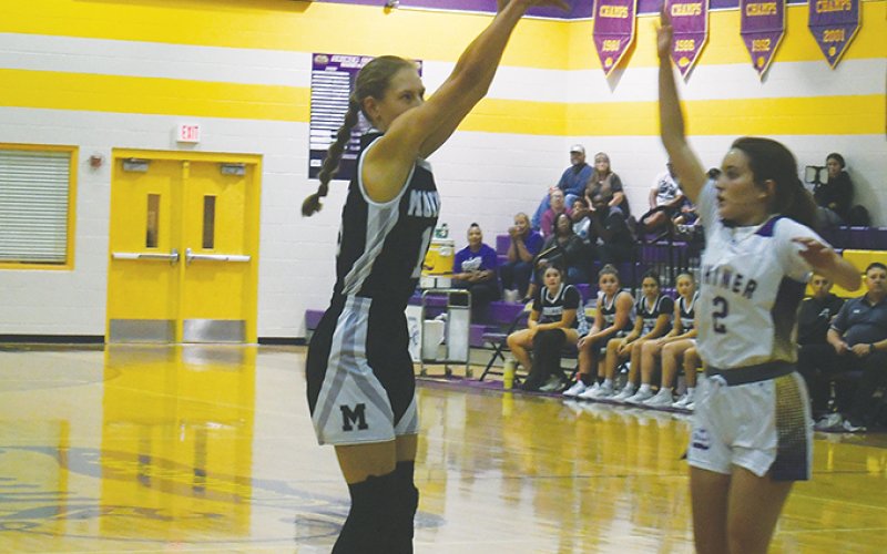 Ava Olivarez takes an inside shot with Shiner’s Emersyn Boehm defending. Olivarez scored six points. Photo by Mark Lube.