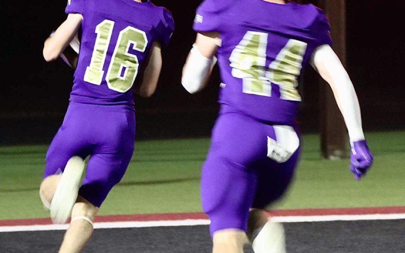 Chase Malinovsky (16) reaches the end zone after recovering a Badger fumble on a  kickoff. Brody Popp (44) escorts him. Photo courtesy of Louann Heinsohn.