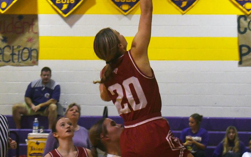 Lady Cardinal Kristin Cerny makes a first-half layup while Shiner’s Kenzie Springfield (middle) defends. Also in on the play is Reese Chilek (left). Photo by Mark Lube.