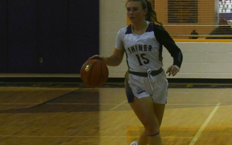Shiner senior Hailey Radicke brings the ball up court during the second half against St. Paul on Dec. 2. Photo by Mark Lube.