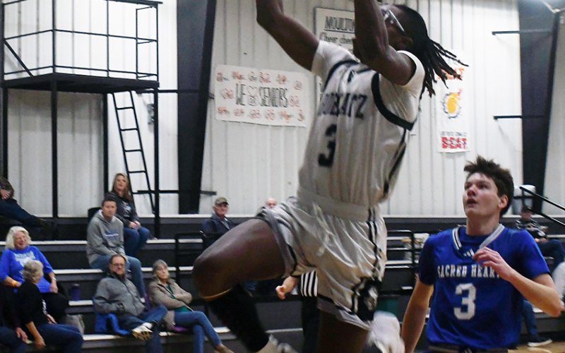 Ja’Michael Williams leaps toward the basket in Thursday’s game against Sacred Heart. He finished with eight points. Photo by Mark Lube.