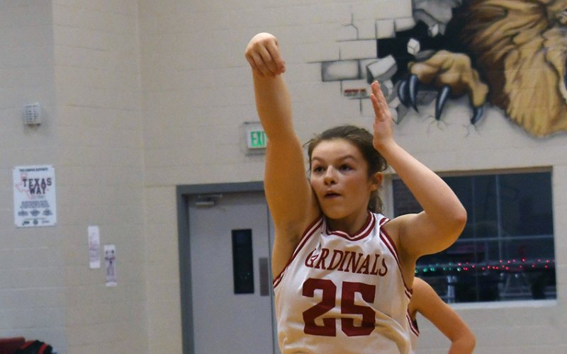 Annabelle Collins follows through on a free-throw attempt against Kenedy. She contributed three points. Photo by Mark Lube.