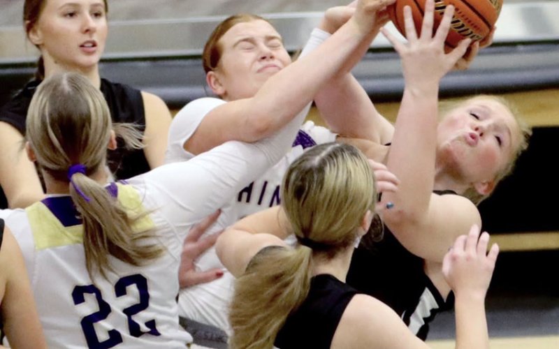 Lexi Boner tries to grab the ball during a Fayetteville Tournament game. Photo courtesy of Louann Heinsohn.