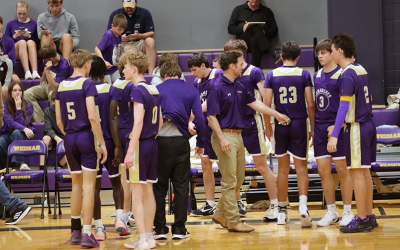 The Shiner Comanches and coaches huddle during a break in the action Friday in Weimar. Photo courtesy of Louann Heinsohn.