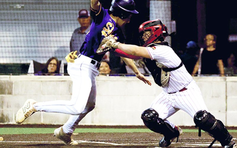 St. Paul catcher Evan Rother tags out Shiner base runner Jake Simper. Photo by Chuck Grafe/Hallettsville Tribune-Herald