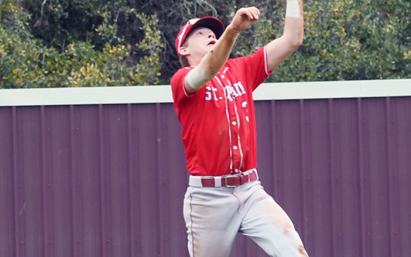 Shortstop Jace Matias catches a fly ball during St. Paul’s Flatonia Tournament game against Schulenburg on Friday morning. He made one putout and four assists. Photo by Mark Lube.