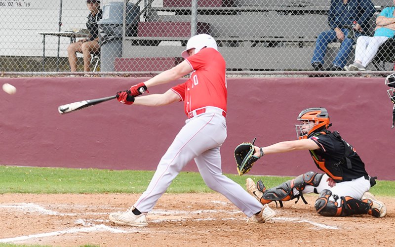 CJ Fogle singles against Schulenburg. His hit was one of three for St. Paul against the Shorthorns. Photo by Mark Lube.