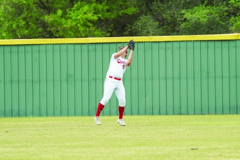 Kade Leist catches a fly ball against Sacred Heart during the Cardinals’ shutout win April 19. Photo courtesy of Photos by Lori Raabe.