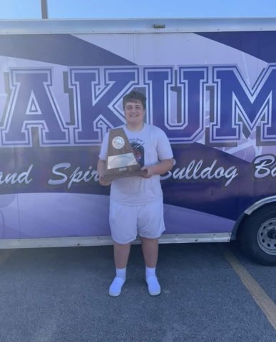 Jordan Ledlow poses with an award from a band compeition. Contributed photo.