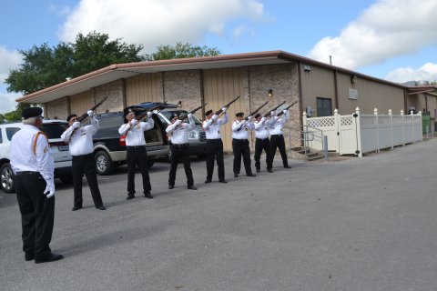 Members of the Vietnam Veterans of America Lone Star Chapter 854 prepare to fire a 21-gun salute during Memorial Day ceremonies in May 2018.