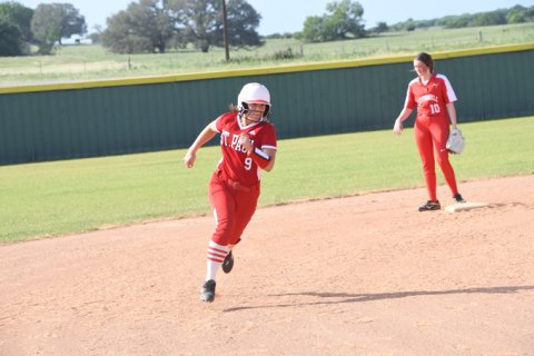 Stefany Pokluda races for third base against O'Connell. She had two home runs. Photo by Mark Lube