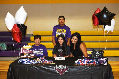 Jocelyn Moreon will run cross country and track at McMurry University. Seated from left is Gloria Moreno, Jocelyn Moreno and Maria Moreno. Standing is Araulfro Moreno. Photo by Mark Lube,