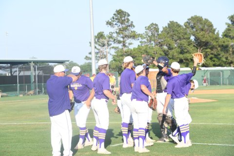 The Shiner Comanches have a short meeting before the game. Photo by Mark Lube.