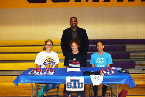 Lady Comanche swimmer Anaya Robinson will attend school in the Miami, Florda-area at St. Thomas University. Seated From left is Isis Robinson, Anaya Robinson and Cryah Robinson. Standing is Peter Robinson. Photo by Mark Lube.