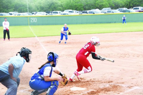 St. Paul senior Seryna Garza attempts a bunt in the Lady Cardinals’ 5-4 home win against rival Sacred Heart Indianettes on April 26 at the Shiner Starplexe. Garza scored one run. Photo by Mark Lube.