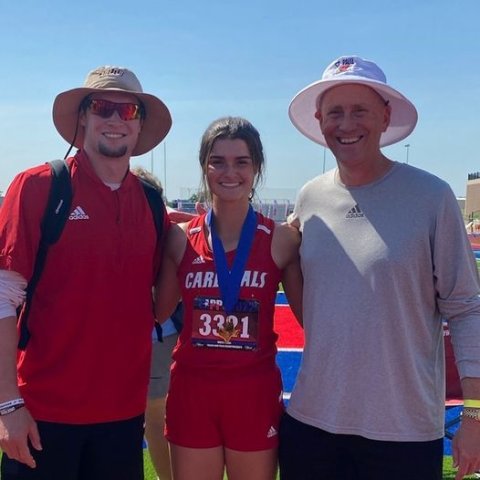 Shiner Catholic School Junior Ashlyn Pesek, shown here Coaches Ryan Geiger, left, and Jake Wachsmuth, won gold at the state track meet in the high jump. 