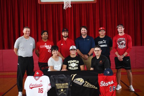 Zak Johnson accepted an offer from Temple College to play baseball. A ceremony was held May 19 to celebrate his achievement. Seated from left is Beth Johnson, Zak Johnson and Ron Johnson.Standing from left is athletic director Jake Wachsmuth, assistant baseball coach Jeremy Rodriguez, head baseball coach Charlie Mieschen, assistant baseball coach Jeff Natho, Blue Hybner and Ryan Geiger. Photo by Mark Lube.