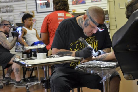 Trey Harris and Josh Fluitt tattoo guests at Yoakum Ink Friday, June 10.