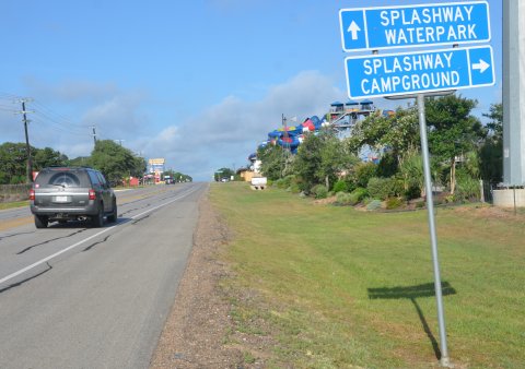 Cars zoom past Splashway Waterpark and Campgrounds in Sheridan on SH 90 Alternate. Photo by Hans Lammeman.