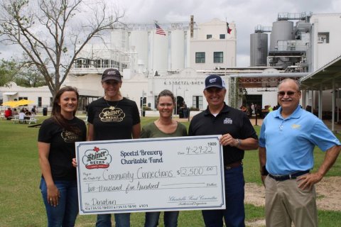 Becky Janak, Program Manager of CCLC (center), accepted the donation and is pictured with brewery team members Lauren Schuette, Julie Boehm, Tom Fiorenzi and Jimmy Mauric.