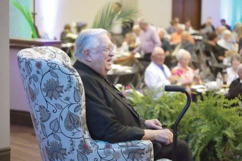 The Rev. Monsignor John Peters, pastor of Sacred Heart in Hallettsville, willingly sat as the target of a little needling, as well as a little praise, for the 2022 Roast and Toast to benefit the Emmaus Counseling Center. Photo by Janet Jones/The Catholic Lighthouse