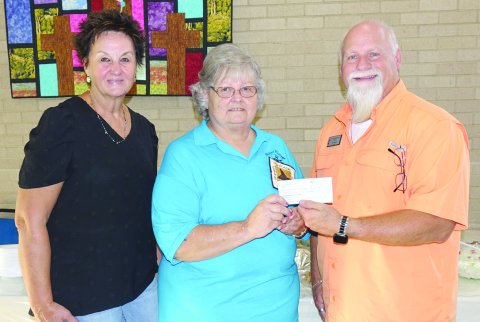 Pictured are, left to right, FUMC secretary Mary Kristynik, Shiner Heritage Quilters President Janet Ferguson and Pastor Darin Zumwalt.