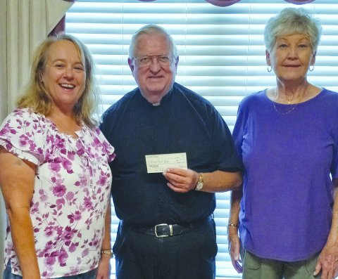 Pictured are, left to right, Monica Peters, Msgr. John Peters and Helen Janak.