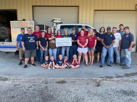 Friends and family members of Sweet Home’s Ben “Bird” Kopecky gathered recently at Sweet Home VFD Fire House to present the department with the dollars their benefit, “Bird’s Booze Wagon,” helped raise for local firemen this year. The amount came to $6,465. 