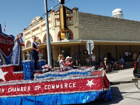 Miss Moulton Hope Kirkland, Junior Miss Alyssa Jasek, Little Miss Emma Henderson and Little Mister Ryan Koncaba make their way around the landmark SouthStar Bank corner in downtown Moulton as part of the 60th annual Jamboree Parade in 2021. Jamboree Week kicks off this weekend with the 2022 Miss Moulton Pageant, starting at 6 p.m. Sunday, July 23, at the Legion Hall.