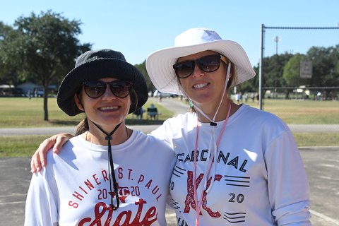Nicco Brown (left), shown here during a 2021 cross country meet with assistant coach Karli Rodriguez, is the head coach of St. Paul volleyball program. Photo by Mark Lube.