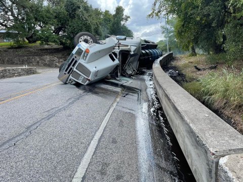Tanker overturns Sunday coming into LasGrange, spilling oily mud all over the road and requiring specialized HAZMAT team cleanup.