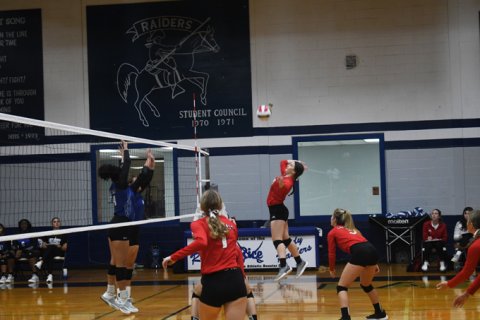 Emily Stamport jumps up for a kill attempt in St. Paul’s two-set win over Rice Friday morning at the Rice Tournament. Photo by Mark Lube.