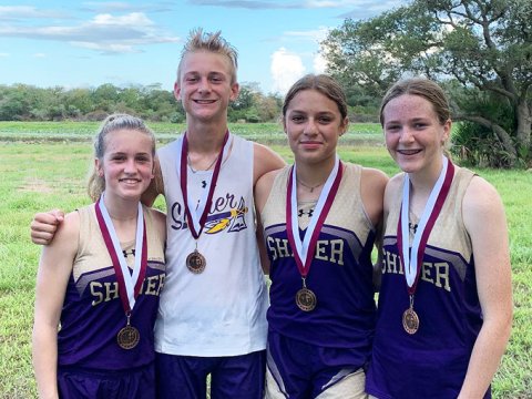Shiner varsity CC medalists from Saturday’s Industrial meet. From left is  Hayleigh Bruns, Boe Boehm, Brinley Ramirez and Callie Chrismon. Photo courtesy of Michelle Winkenwerder.
