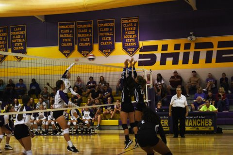 Yoakum attempts a block in Thursday's pool match against Shiner. Photo by Mark Lube.
