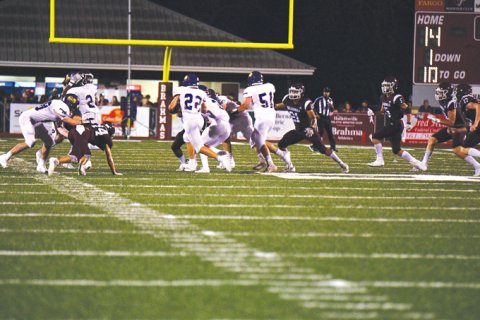 Shiner running back Beck Bishop carries the football in the Comanches’ opener Friday night at Hallettsville. Photo courtesy of Chuck Grafe/Hallettsville Tribune-Herald.