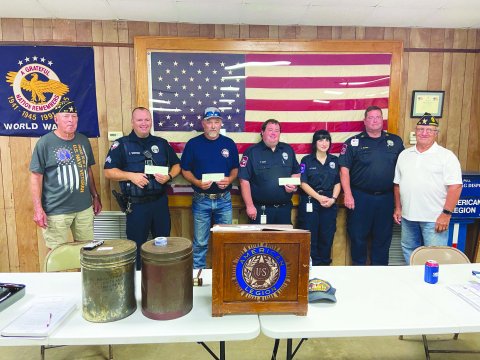 Pictured are, left to right, David Muehlstein, James Whited, Jason Shows, Tyler Havel, Abby Pulatie, John Schultz, and Commander Jimmy Strait.