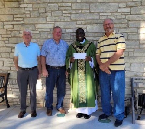 Pictured are Deacon John McCourt, Moulton Grand Knight George Kalisek, the Rev. Felix Twumasi of the Hostyn Catholic Church near La Grange, which exploded June 9 in a freak accident that claimed the life of one of its longtime parishioners, and Moulton KC Treasurer John Bumpas.