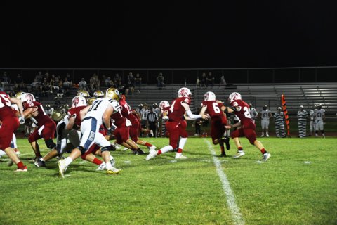 Alex Browns starts clearing a path while Jacob Wachsmuth hands off to Zane Barta. Photo by Mark Lube.
