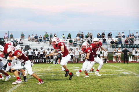 Jacon Wachmuth hands off to Brayden Slaughter. 